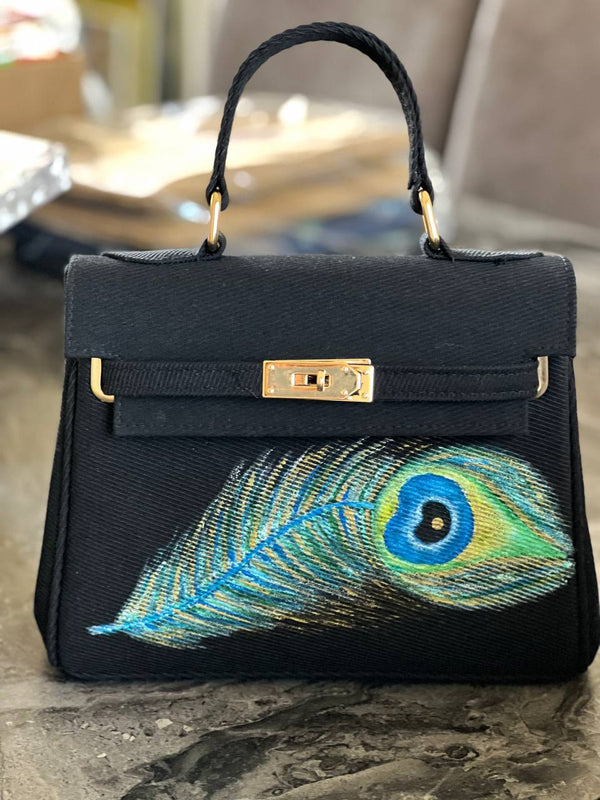 Hand made bag with eye feather